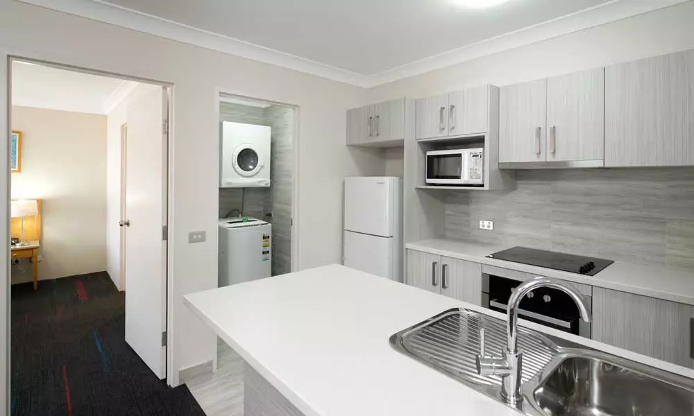 APX Hotels Apartments Parramatta clean three bedroom kitchen and laundry area in Parramatta CBD Australia
