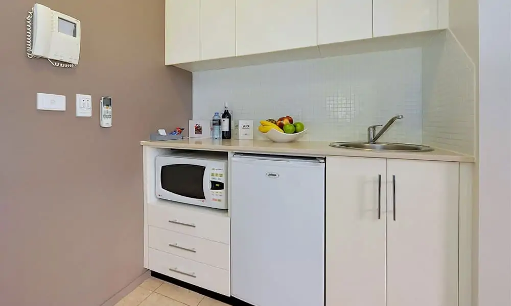 APX Darling Harbour complete kitchen in standard studio apartment accommodation in Sydney Australia