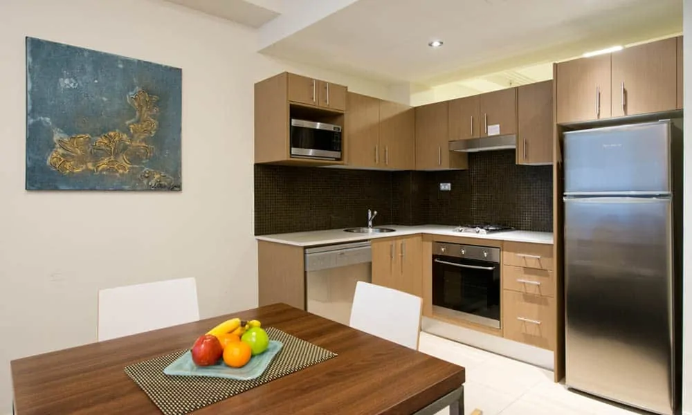 APX Hotels Apartments clean executive studio apartments kitchen and dining room in World Square Sydney Australia