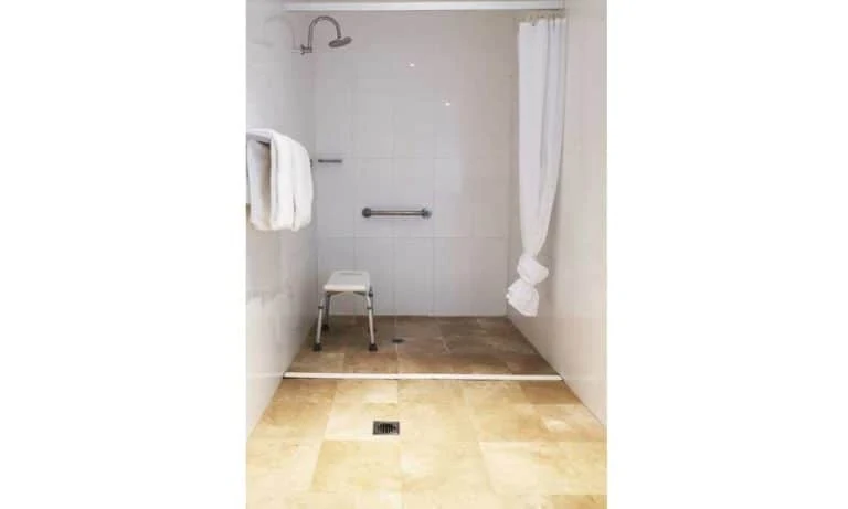 APX World Square Accessible apartments clean and comfortable accessible bathroom and shower room in APX Hotels Apartments Sydney Australia