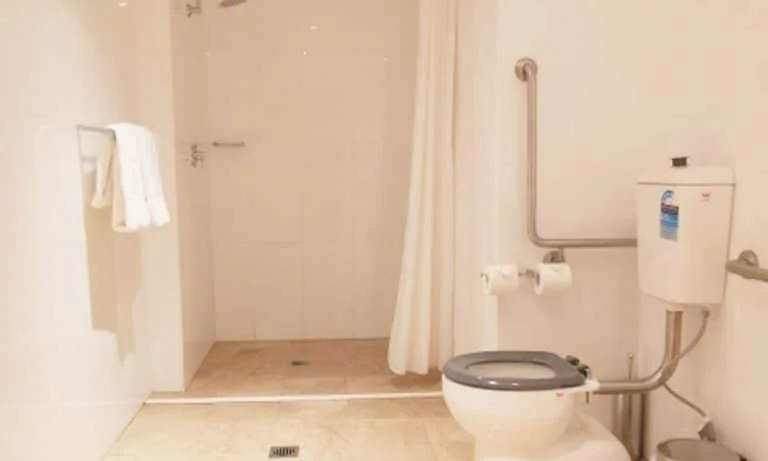 APX World Square Accessible apartments comfortable shower and toilet area in APX Hotels Apartments Sydney Australia