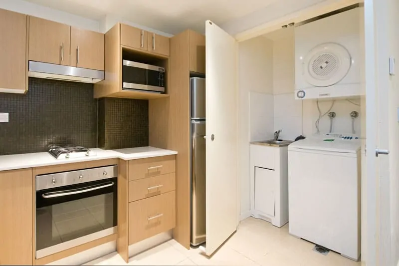 APX World Square clean and comfortable kitchen and laundry area in APX Hotels Apartments Sydney Australia