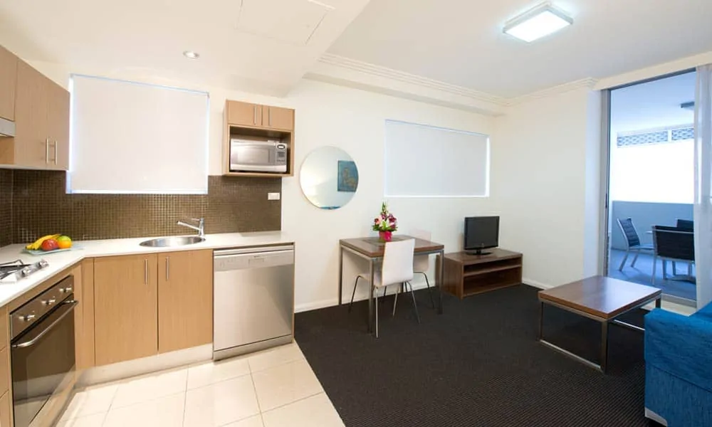APX World Square clean comfortable and elegant executive studio apartments kitchen and dining area in APX Hotels Apartments Sydney Australia