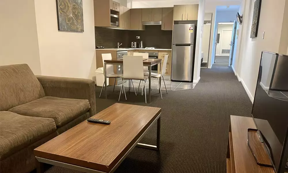 APX World Square clean comfortable and elegant executive studio apartments living and dining area in APX Hotels Apartments Sydney Australia