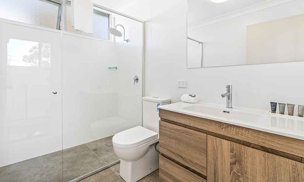 bathroom shower | APX Hotels Apartments | APX Parramatta | accommodation in Parramatta CBD Australia