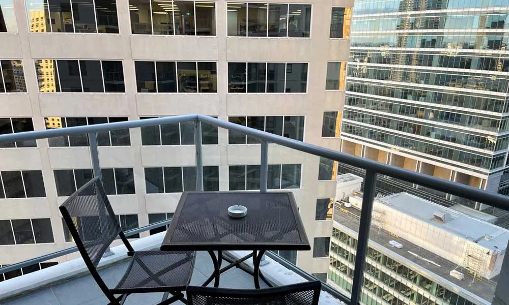 APX standard studio city view balcony in APX World Square