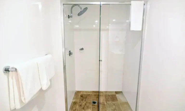 Bathroom with glass and towel holder | APX Hotels Apartments World Square